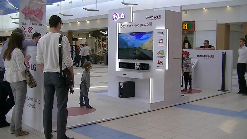 LG CINEMA 3D TV promo stand in a mall.