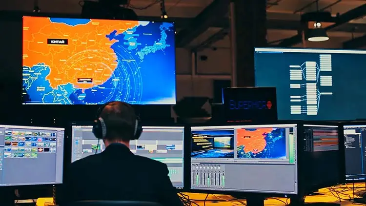 Our Art Director at work. I wonder why he needs so many screens.